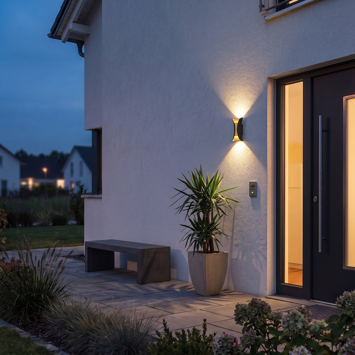 Curved Up Down Outdoor Wall Light styled in a home interior